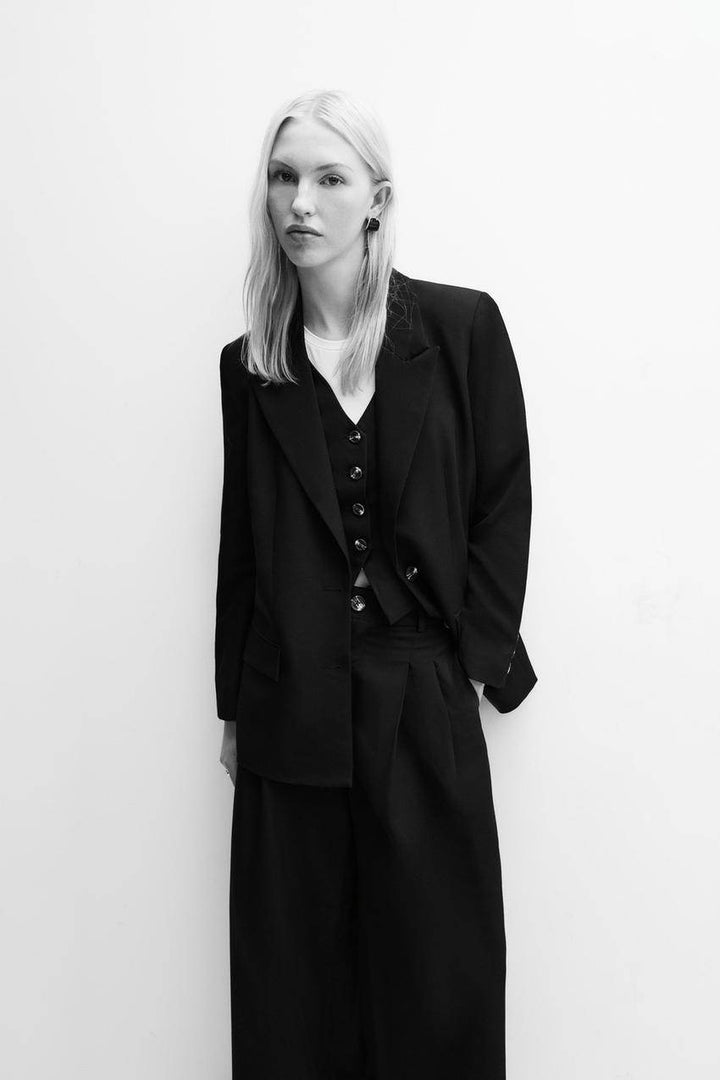 Full body view of a black women's blazer
