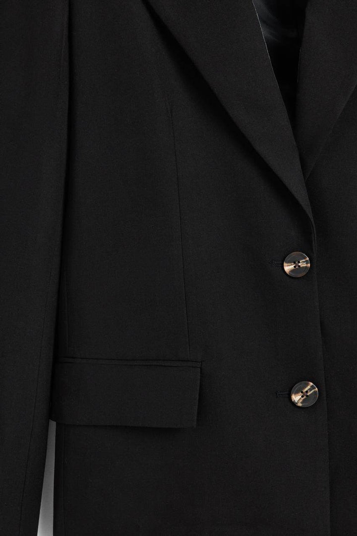 Zoomed view of a black women's blazer
