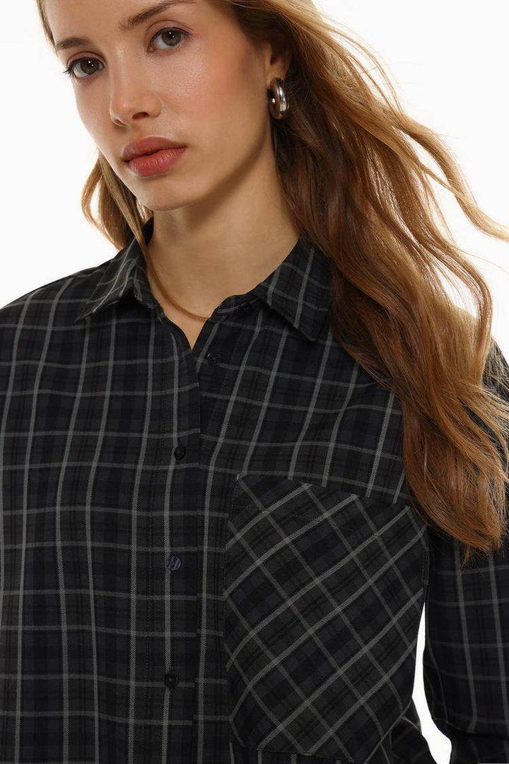 Close-up front view of black checked shirt


