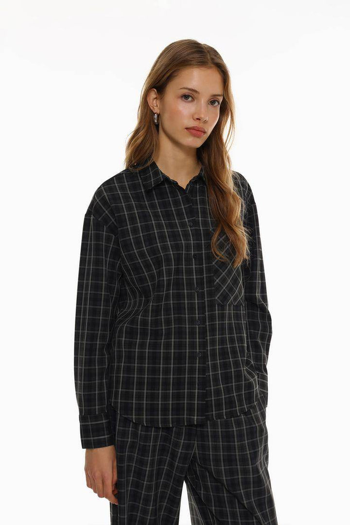 Front view of women's black checked shirt

