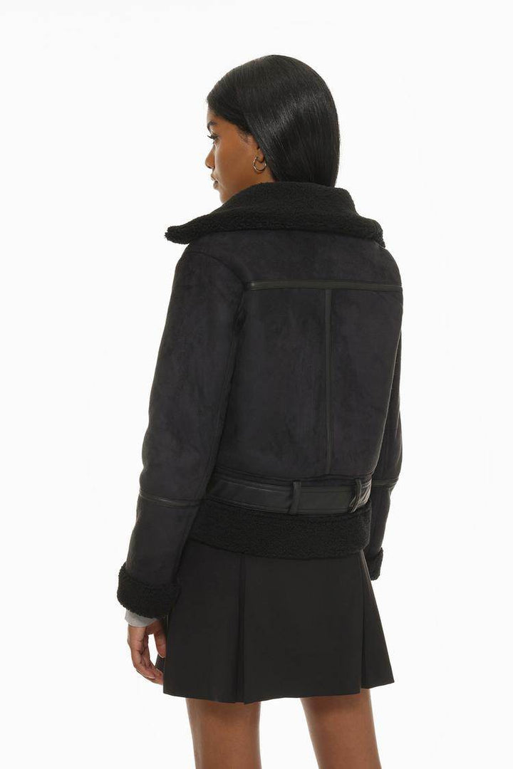 Back view of the women's black double-faced crossover jacket

