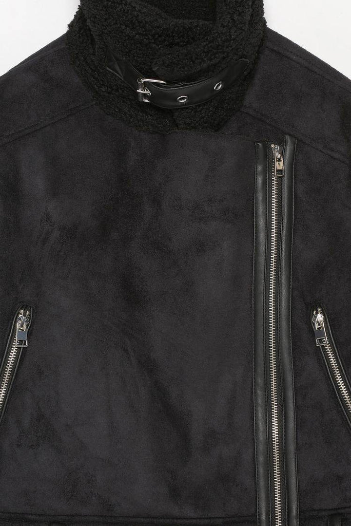 Close-up product image of black crossover jacket details

