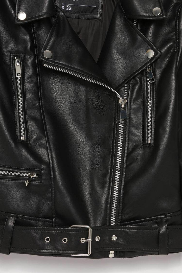 Close-up product image of black faux leather crossover jacket

