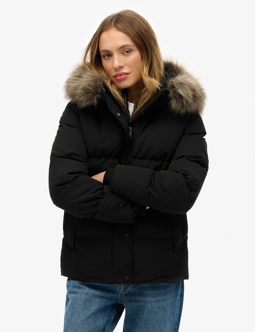 Close-up front view of the black hooded funnel neck puffer

