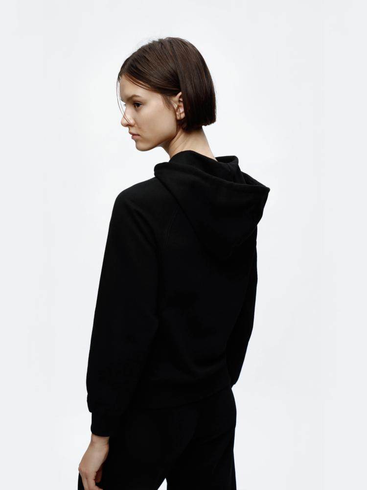 Side view of the women's black hooded jacket

