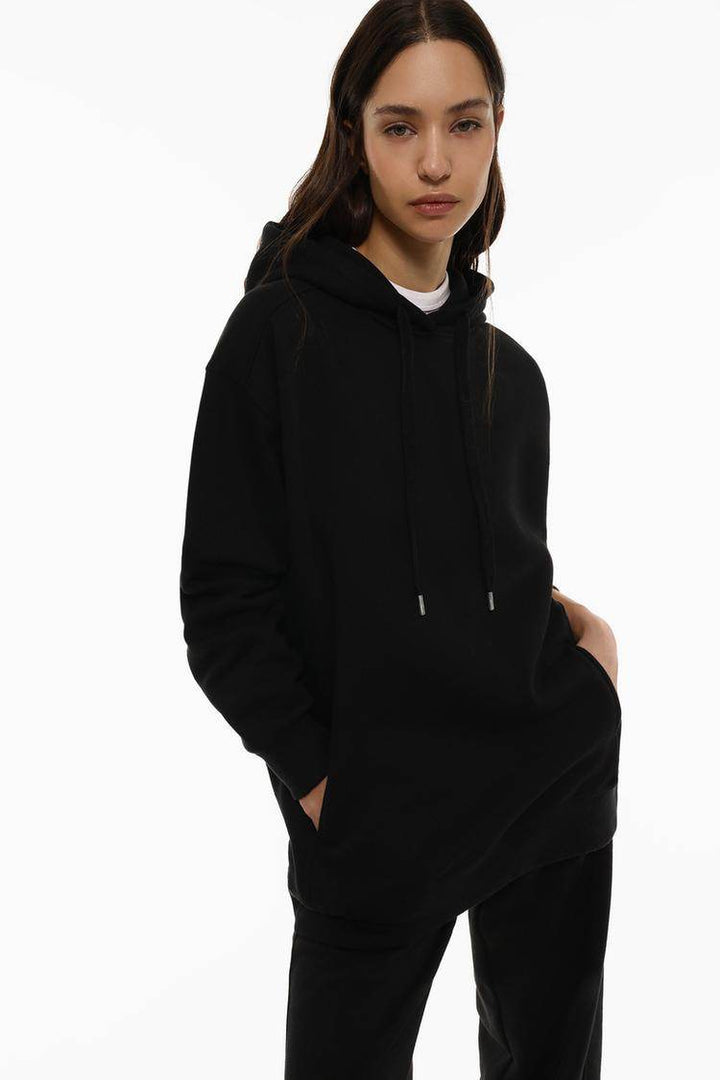 Close-up front view of black plush sweatshirt fabric

