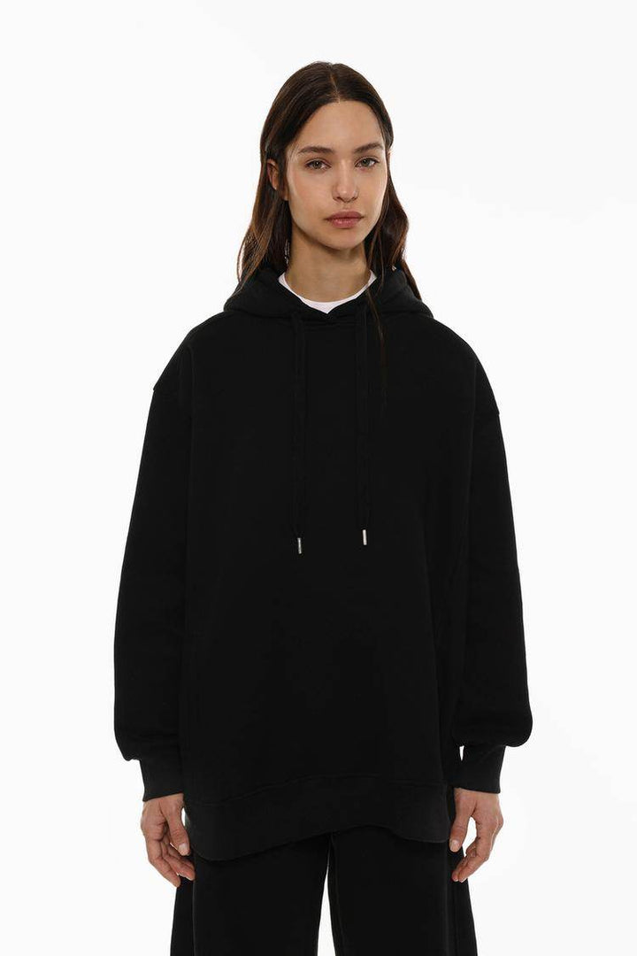 Front view of women's black oversized plush sweatshirt

