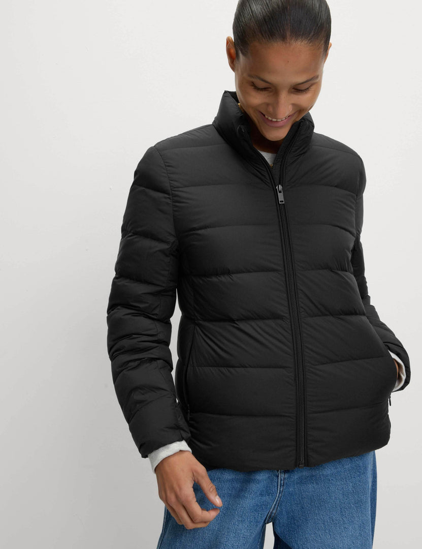 Close-up front view of the women's black puffer jacket

