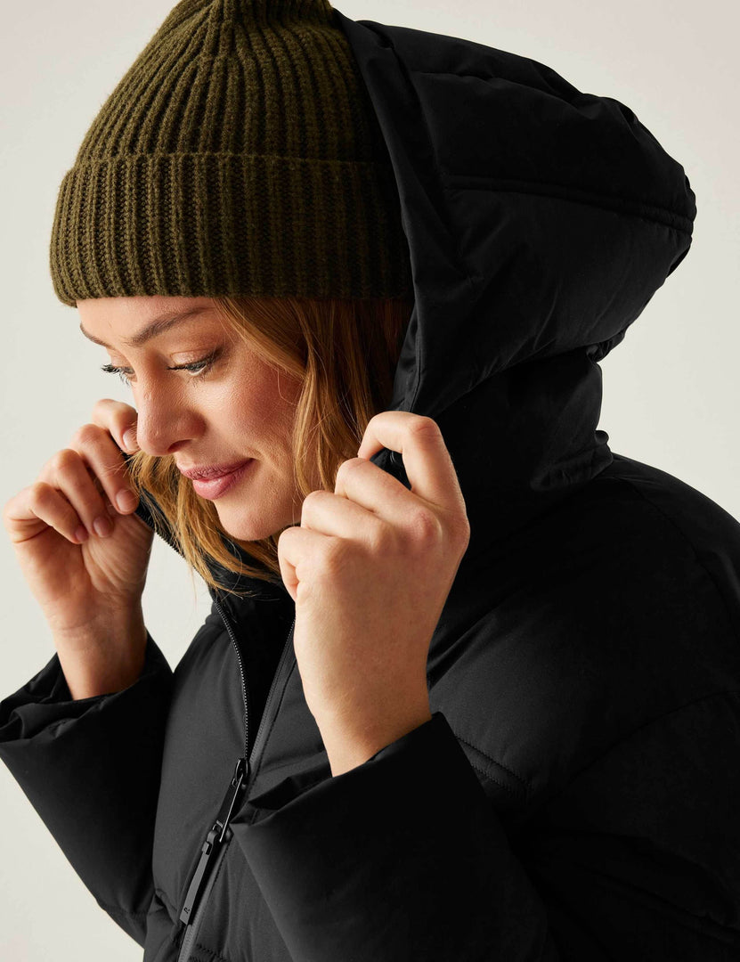 Zoomed in side view of the black quilted puffer jacket

