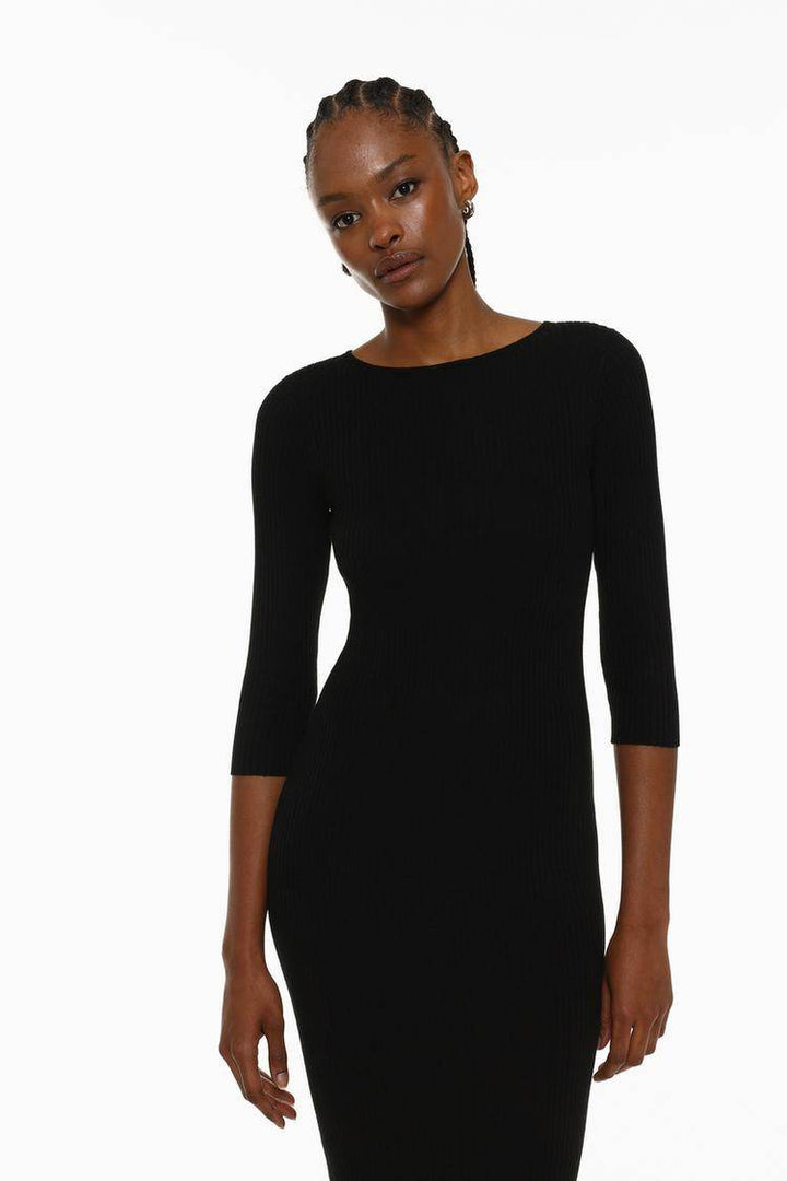 Close-up front view of the black ribbed midi dress fabric

