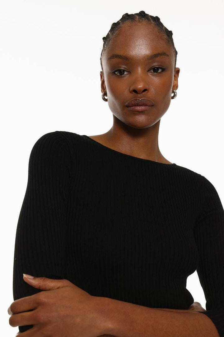 Front view of the women's black ribbed midi dress

