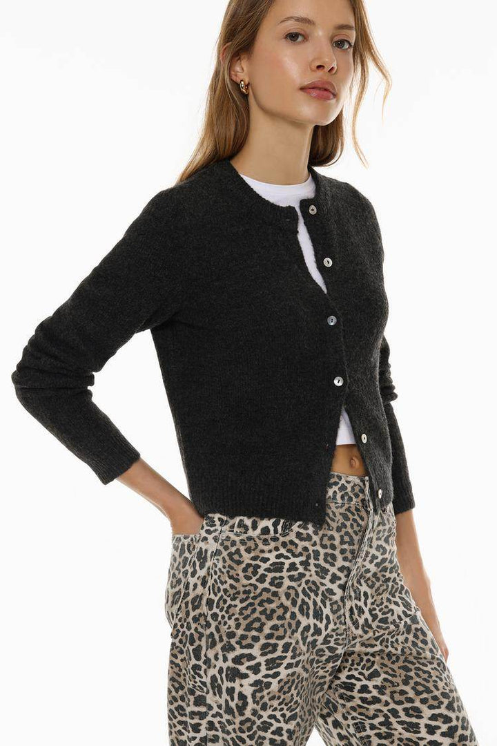 Side view of the women's black rounded neck knit cardigan

