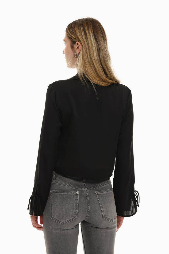 Back view of the women's black satin shirt with ties

