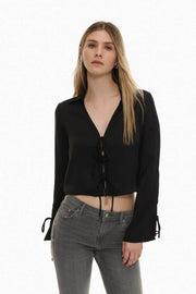 Front view of women's black satin shirt with ties

