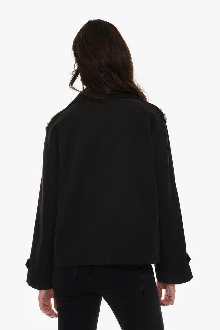 Back view of the women's black short oversize trench coat

