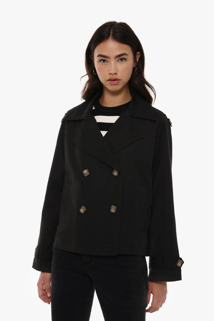 Front view of women's black short oversize trench coat

