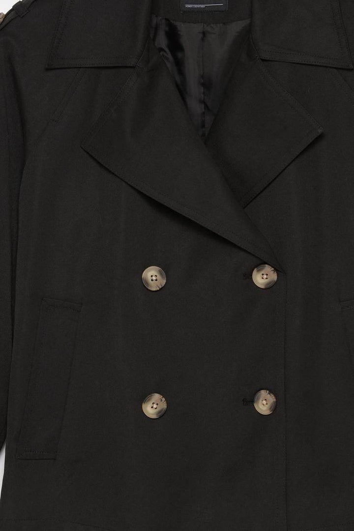 Close-up product image of black trench coat material

