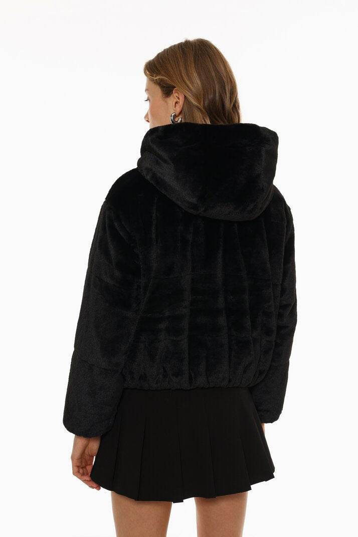 Back view of the women's black short soft coat

