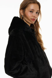 Side view of the women's black short soft coat


