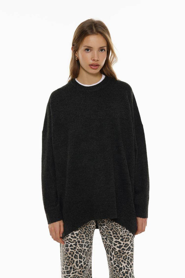Front view of women's black soft knit oversize jumper

