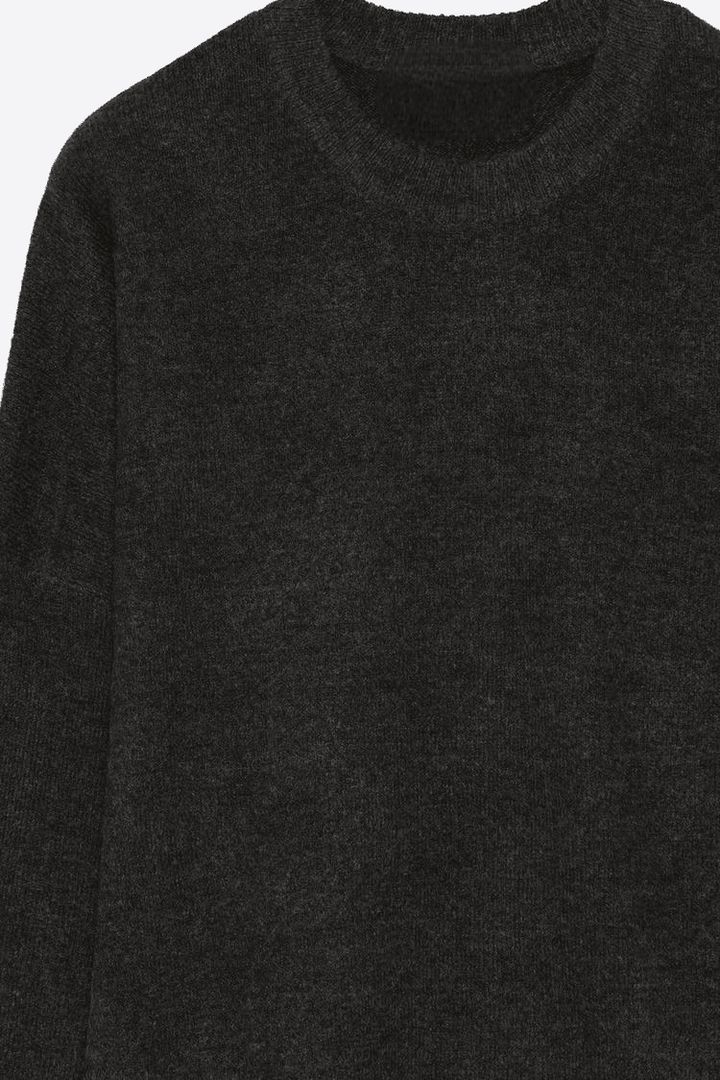 Close-up product image of black soft knit jumper

