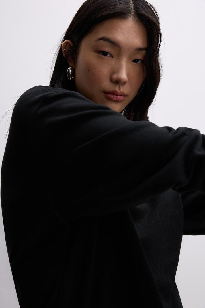 Front view of a black women's sweatshirt
