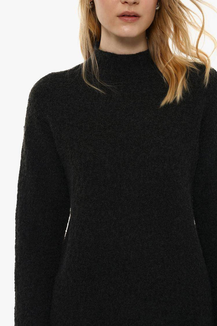Close-up front view of black textured knit

