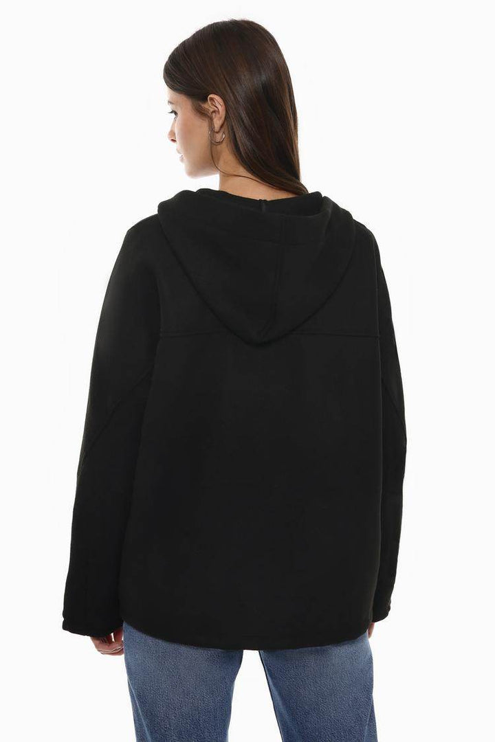 Back view of the women's black wool coat

