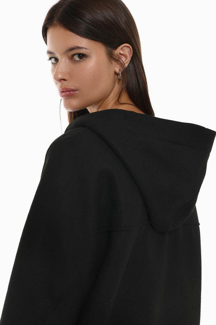 Side view of the women's black wool coat

