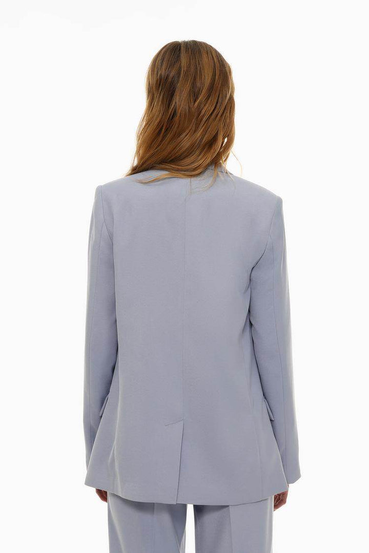 Back view of the women's blue basic blazer

