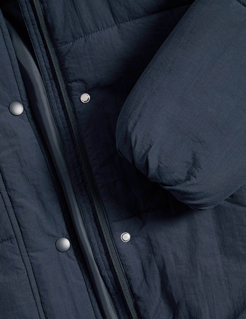 Close-up product image of the blue hooded puffer jacket

