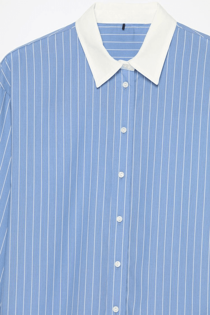 Close-up product image of blue oversized shirt

