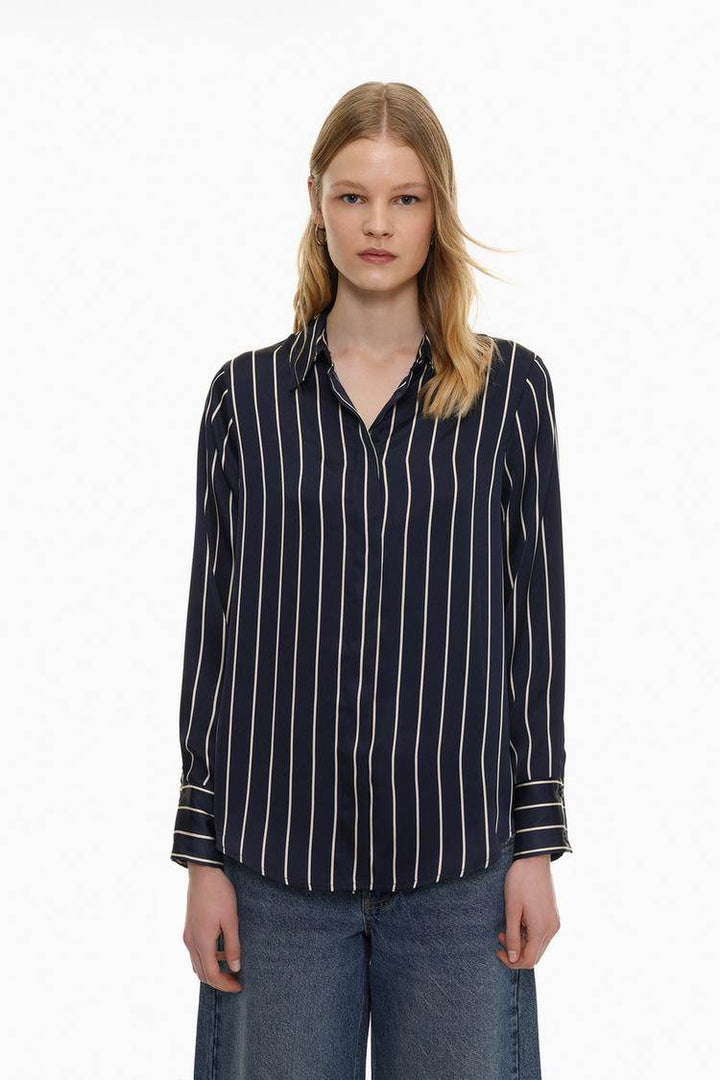 Front view of women's blue satin shirt

