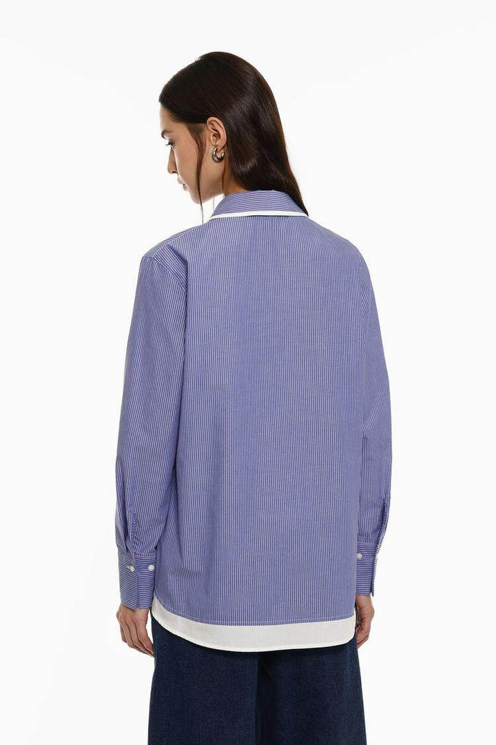 Back view of the women's blue striped shirt

