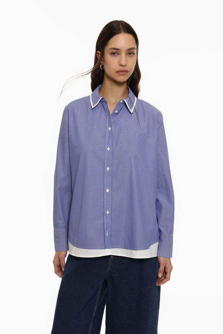 Front view of women's blue striped shirt

