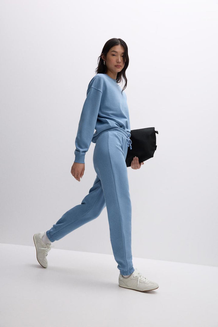 Side full view of a blue women's sweatshirt
