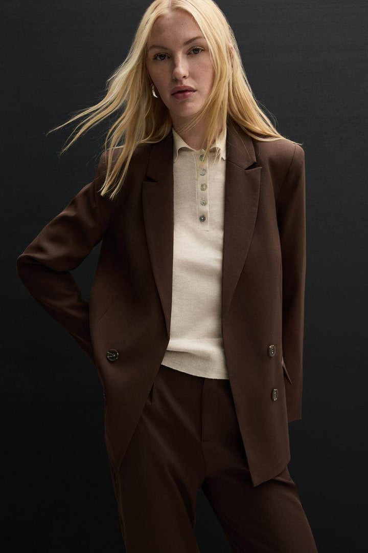 Zoomed in full body view of the brown blazer

