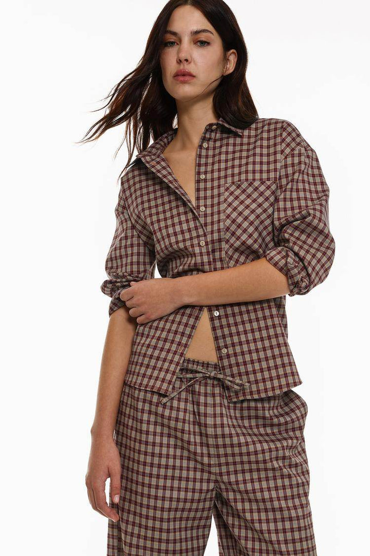 Model showcasing front of brown checked shirt

