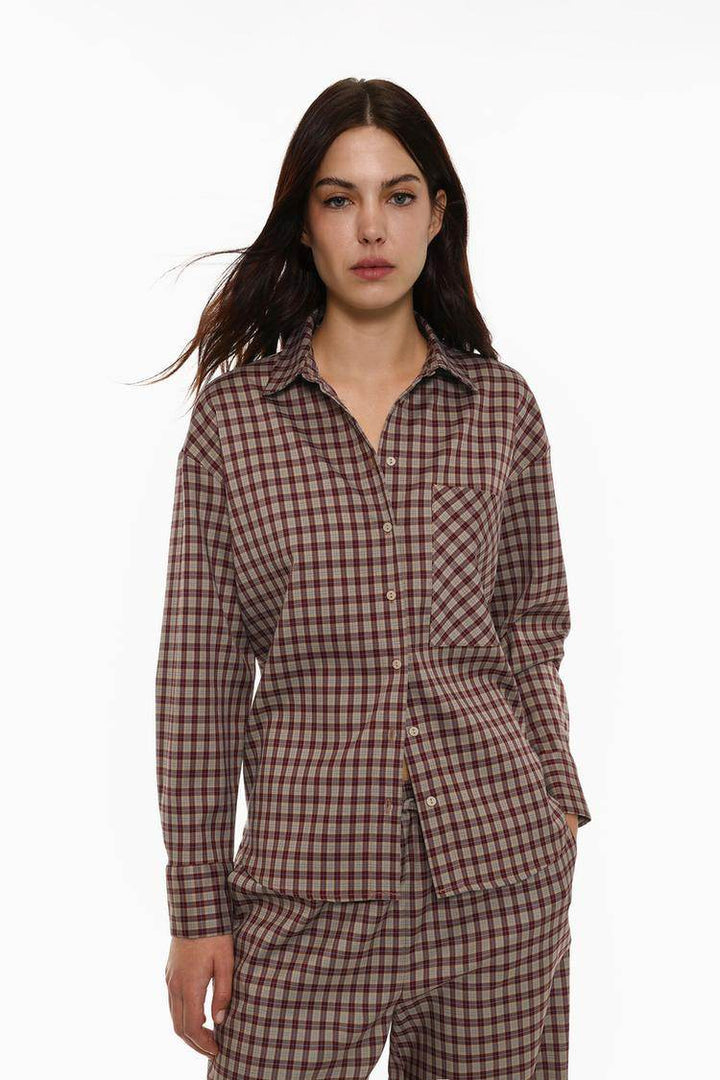 Front view of women's brown checked shirt with pocket detail

