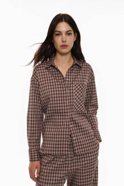 Front view of women's brown checked shirt with pocket detail

