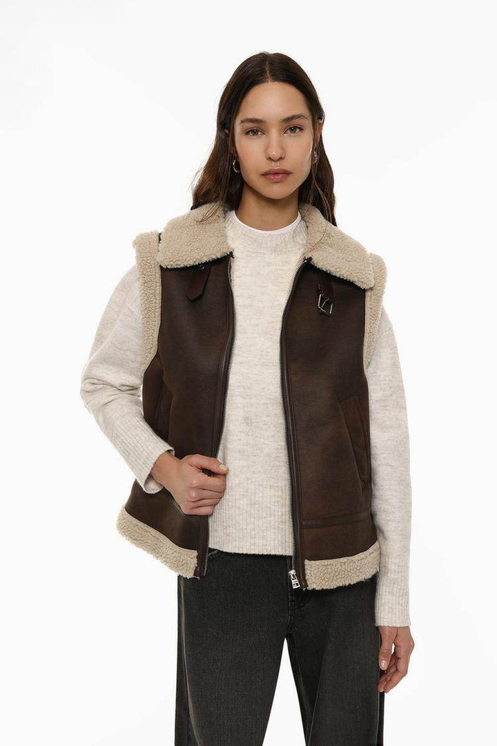 Front view of women's brown double-faced gilet with zip

