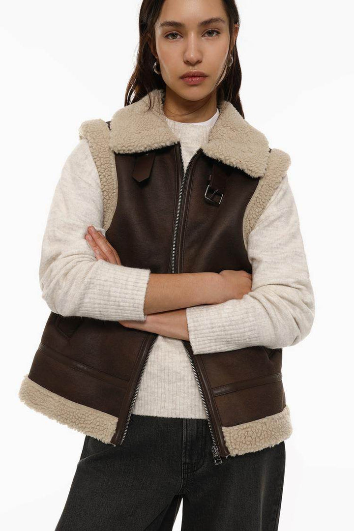 Model showcasing brown double-faced gilet front

