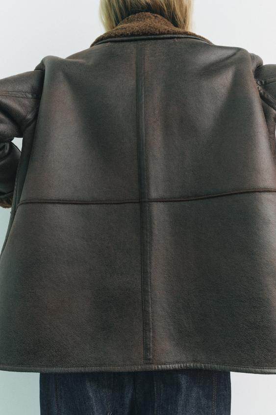 Back view of the women's brown faux leather reversible coat

