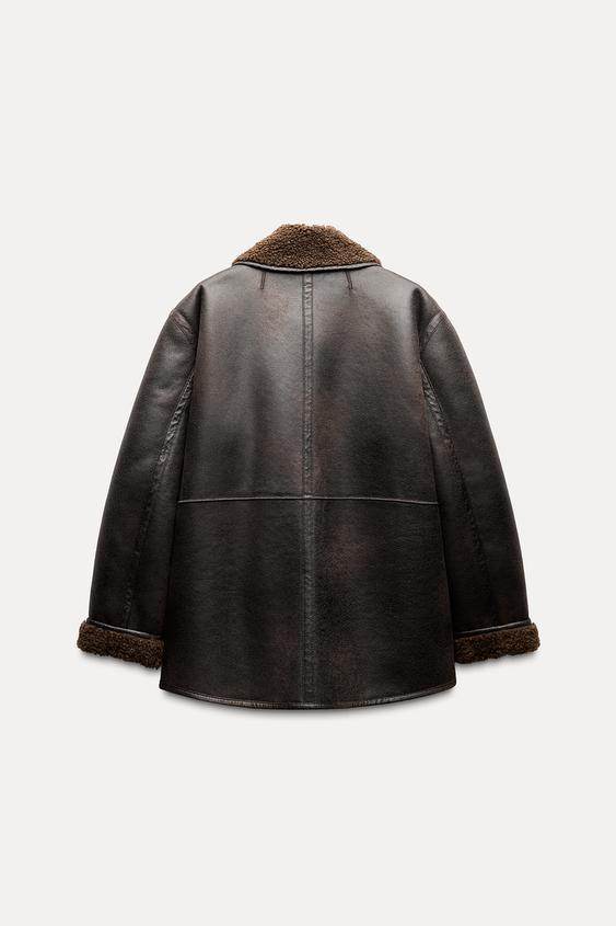 Product back view of brown reversible faux leather coat

