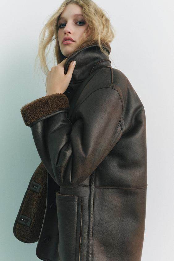 Side view of the women's brown faux leather reversible coat

