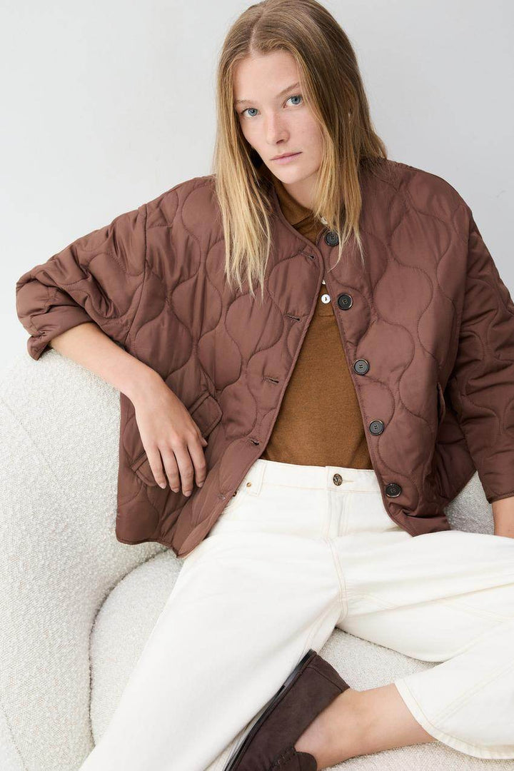 Front view of the women's brown quilted jacket

