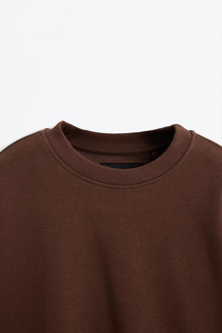 Zoomed view of a brown women's sweatshirt

