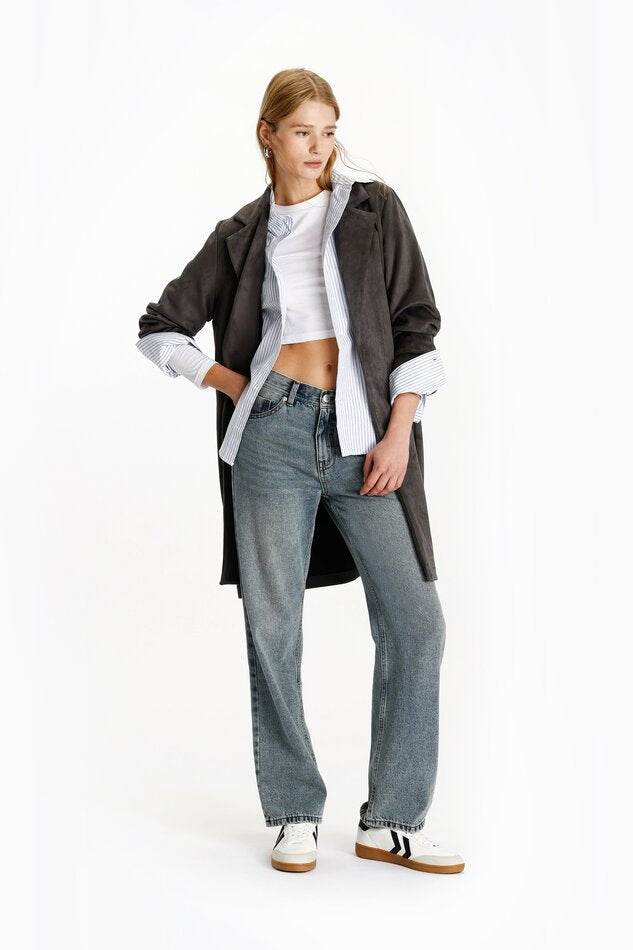 Model showcasing dark green faux suede coat

