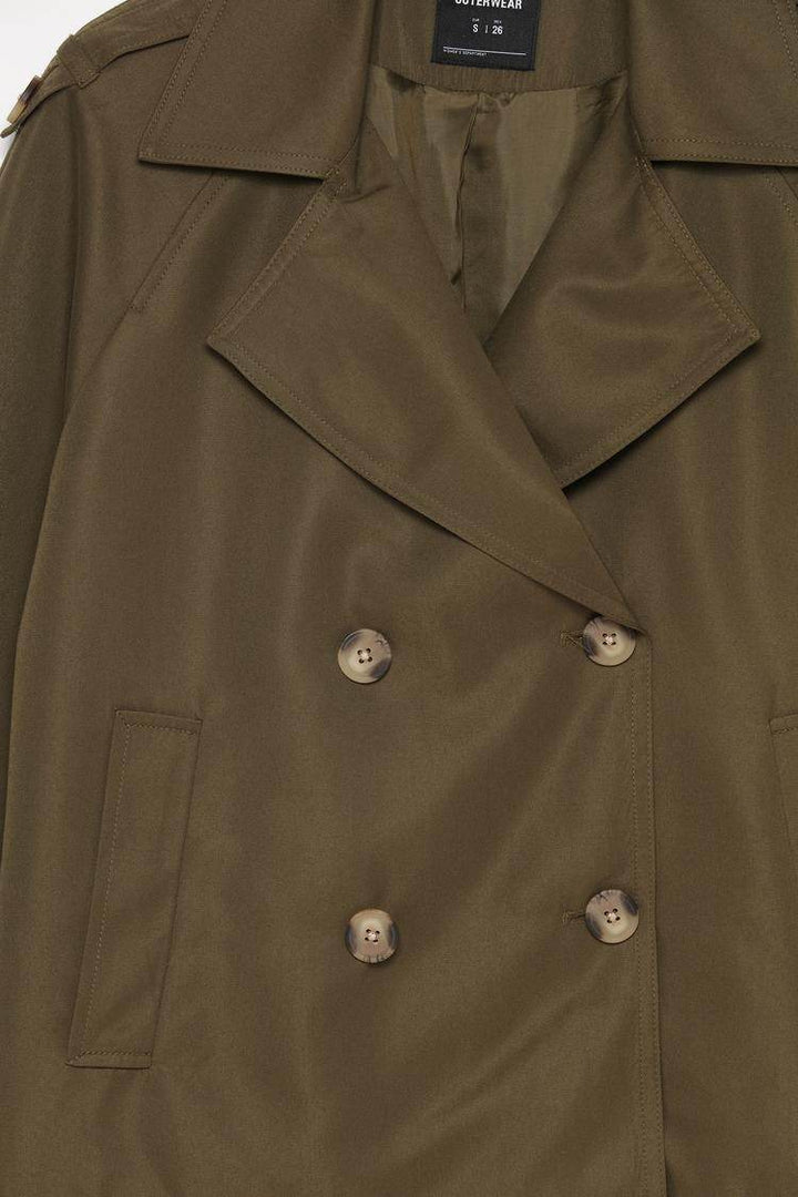 Close-up product image of dark green trench coat

