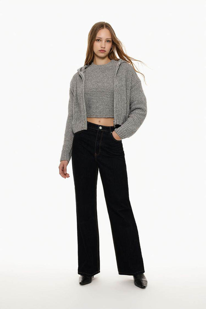 Full body front view of woman wearing grey chenille jacket

